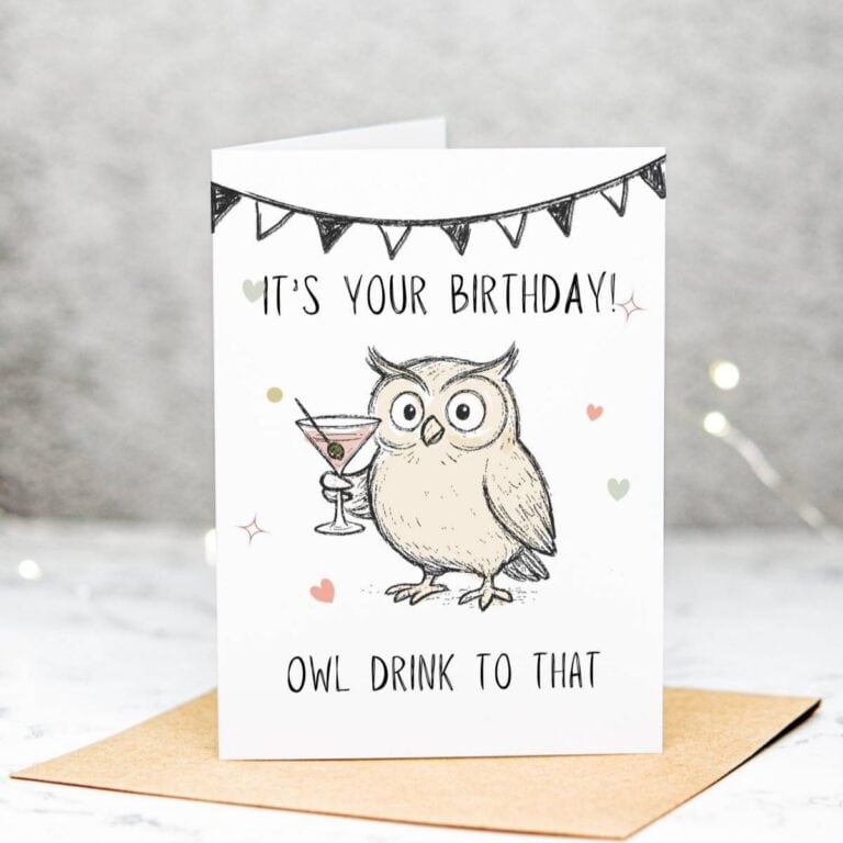 A birthday card featuring a cartoon owl holding a cocktail, with text that reads ITS YOUR BIRTHDAY! OWL DRINK TO THAT. The card is decorated with small hearts and a black bunting banner.