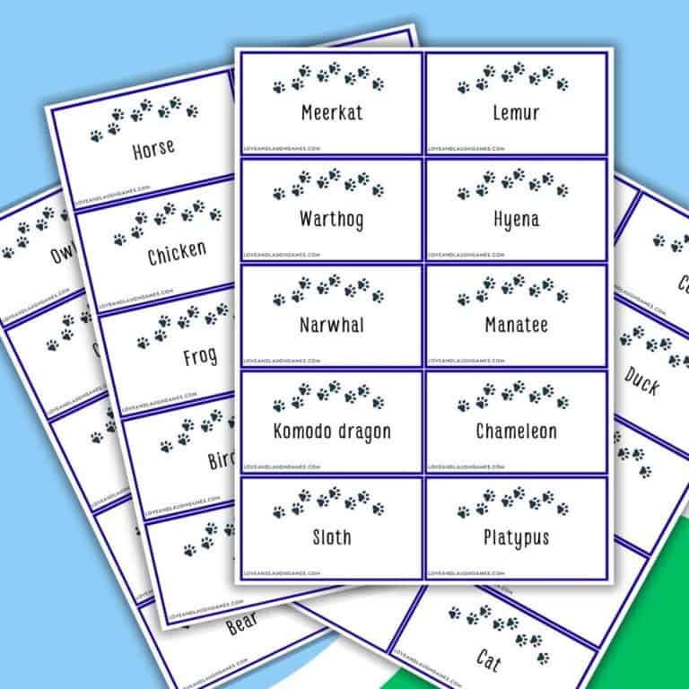 Sheets of animal name cards with paw print borders are spread out, perfect for a fun game of Charades; visible cards include Meerkat, Lemur, Komodo dragon, Chameleon, Platypus, Frog, Cat, and more.